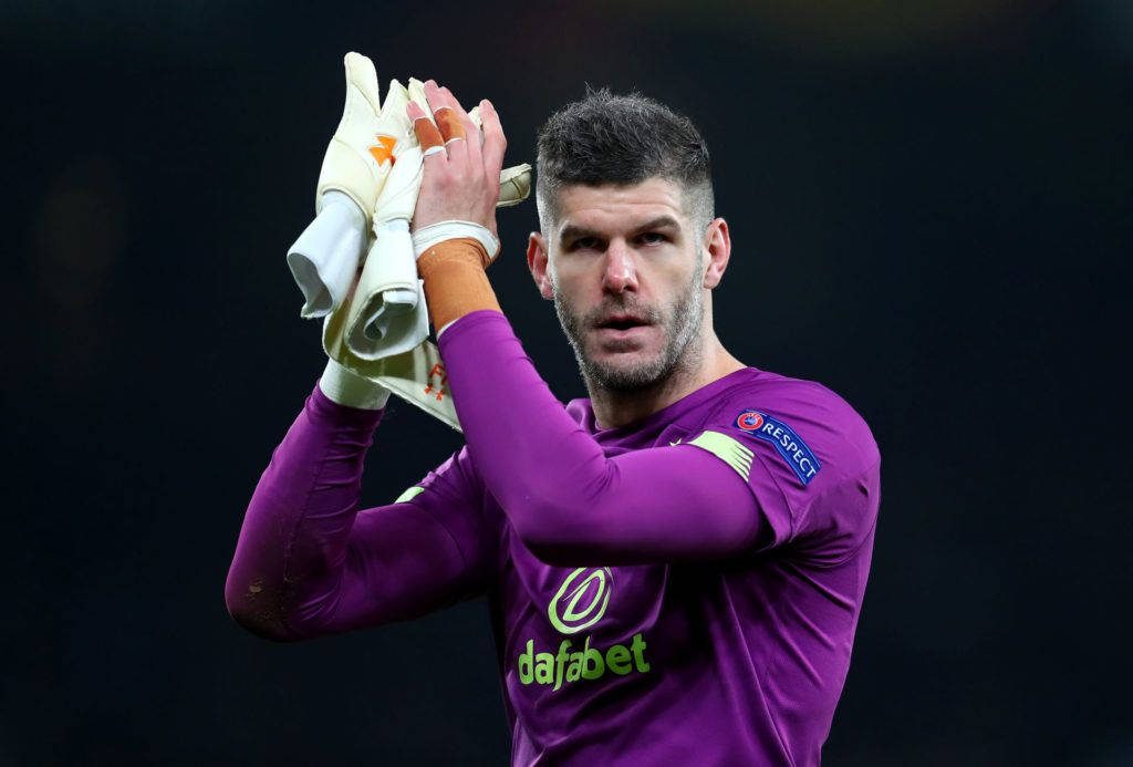 Goalkeeper Fraser Forster clapping in purple Celtic kit Dafabet sponsor focused on pitch wallpaper