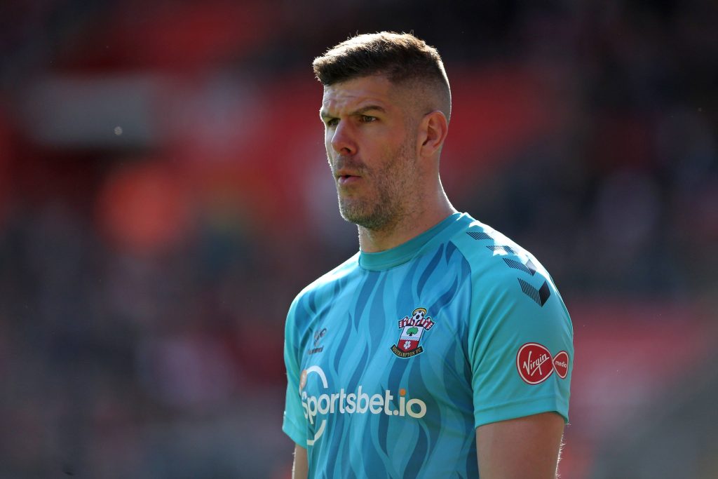 Goalkeeper Fraser Forster in light blue Southampton kit focused during match high-quality wallpaper