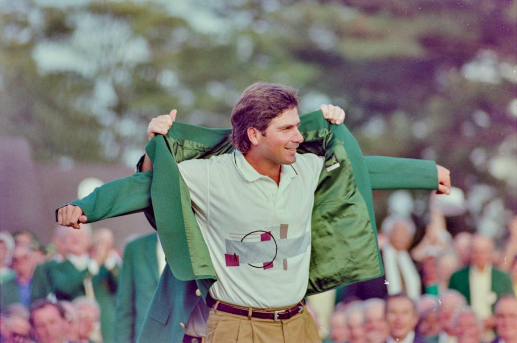 Young Fred Couples wearing Green Jacket after 1992 Masters win in patterned polo and khakis Wallpaper