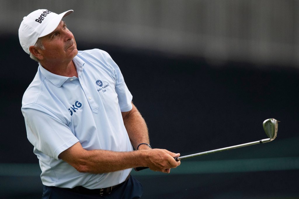 Fred Couples golf swing follow through light blue polo white Berenberg cap sports wallpaper