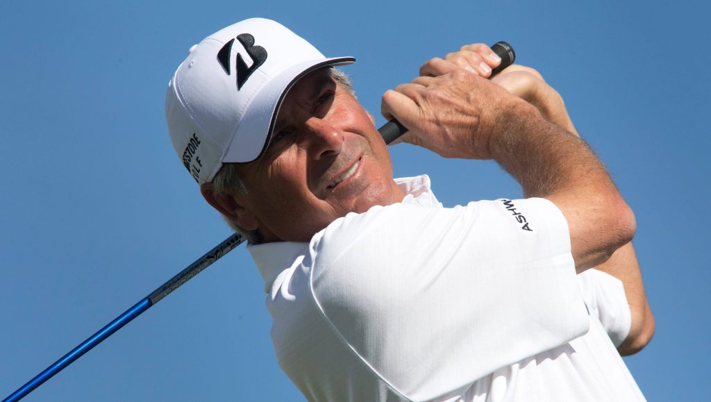 Pro golfer Fred Couples smooth golf swing white cap Ashworth polo blue sky wallpaper background