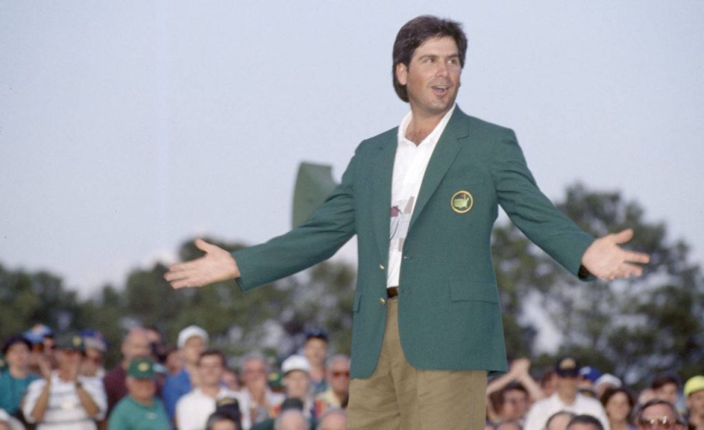 Fred Couples celebrates wearing Masters green jacket with arms outstretched in vibrant golf wallpaper