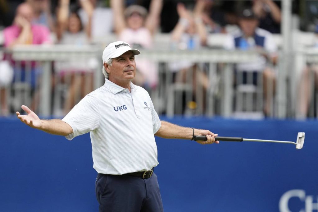 Fred Couples golfing in white striped shirt and Berenberg cap on PGA Champions Tour background Wallpaper