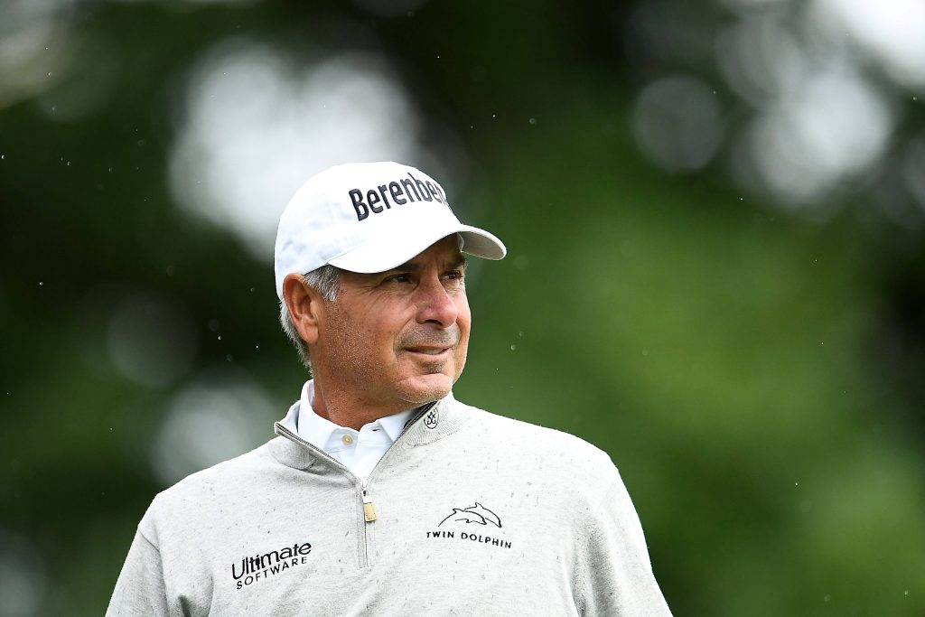 Fred Couples portrait in white Berenberg cap and grey Twin Dolphin sweater on golf course background Wallpaper