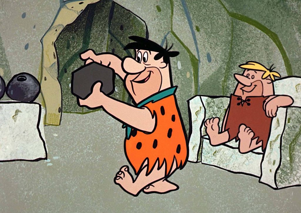 Fred Flintstone bowling with stone ball while Barney Rubble watches vintage Flintstones wallpaper