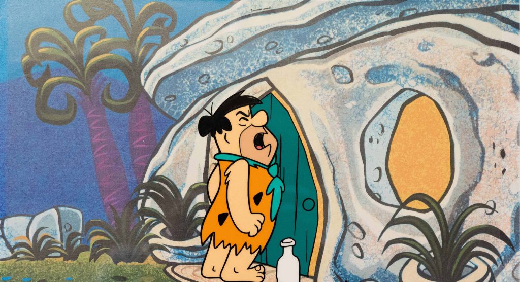 Fred Flintstone shouting outside iconic stone house classic animated Flintstones wallpaper background