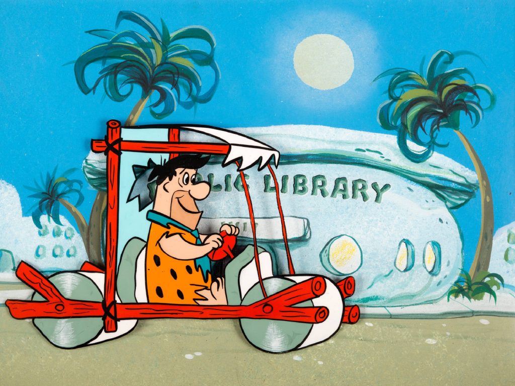 Fred Flintstone driving stone-age car near Bedrock Public Library sunny sky cartoon wallpaper