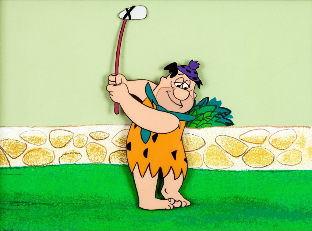 Fred Flintstone mid-swing golfing cartoon wallpaper orange tunic purple cap stone background