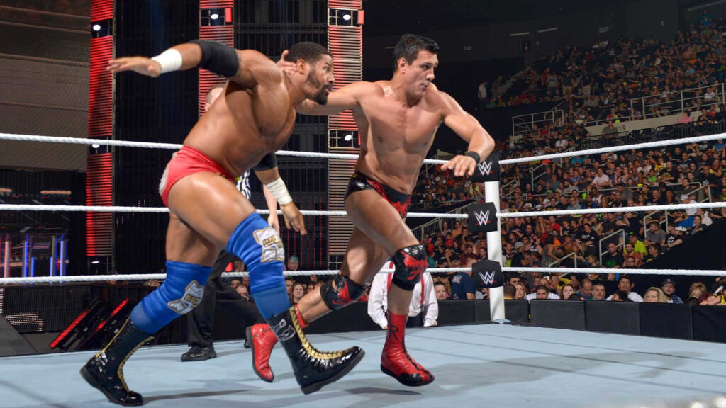 Fred Rosser and Alberto Del Rio intense WWE wrestling match showcasing athleticism in packed arena Wallpaper