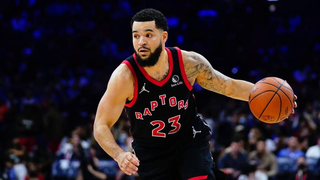 Fred VanVleet dribbling in black Raptors jersey number 23 dynamic NBA basketball wallpaper background