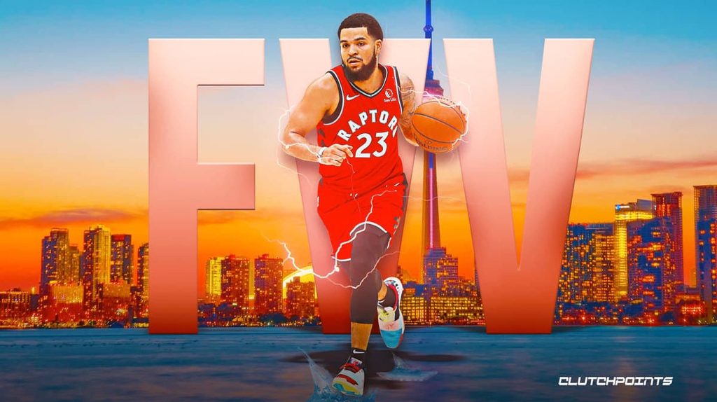 Fred VanVleet dribbling in Raptors jersey with vibrant Toronto skyline and CN Tower background Wallpaper