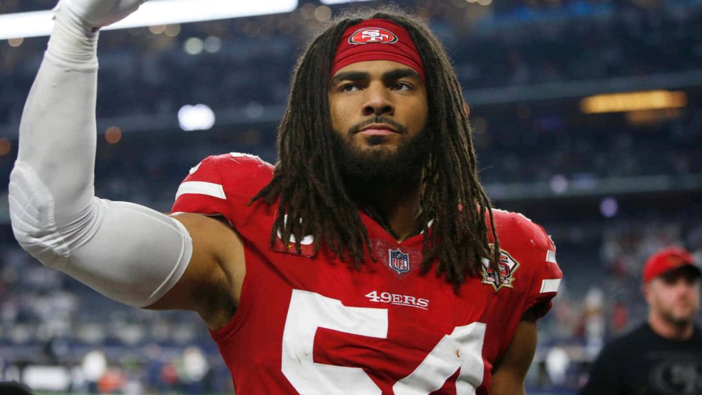 Fred Warner San Francisco 49ers linebacker in red jersey 54 intense pose stadium wallpaper