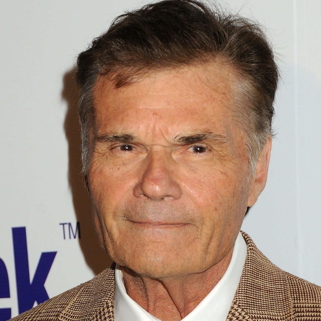 Portrait of Fred Willard in tan jacket and white shirt bright background celebrity wallpaper