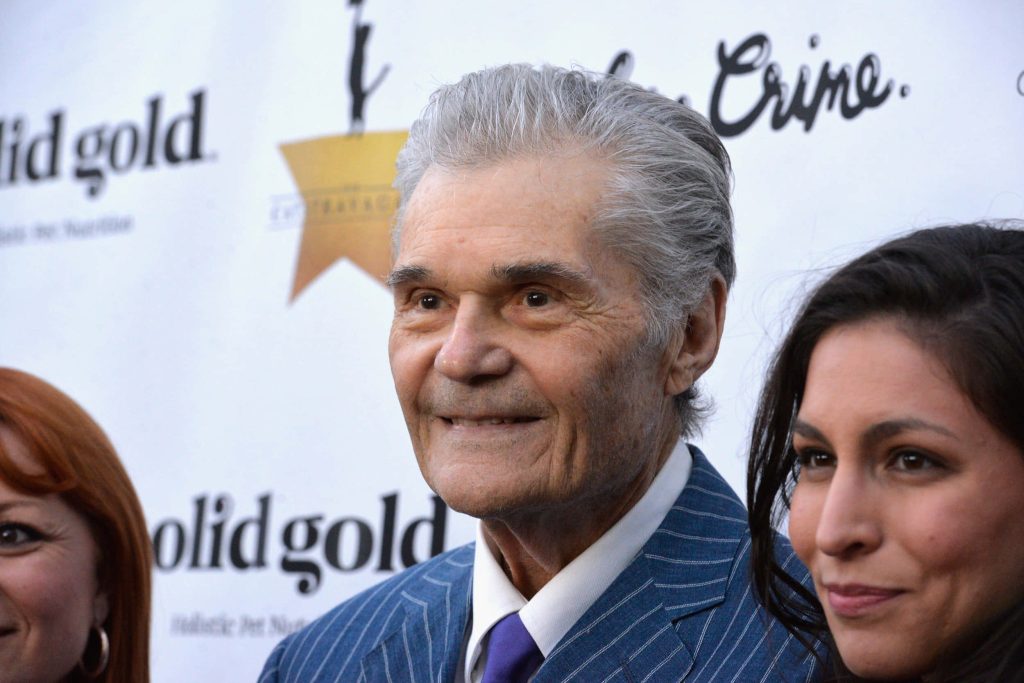 Fred Willard in blue pinstriped suit smiling at Solid Gold event professional photo wallpaper
