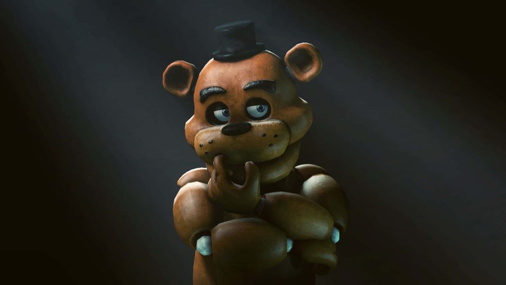 Freddy Fazbear animatronic dark moody lighting thoughtful pose Five Nights at Freddy's wallpaper