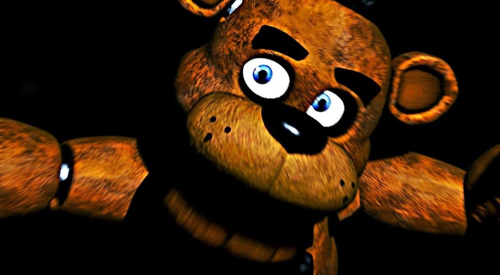 Freddy Fazbear close-up with blue eyes and detailed fur on black background Five Nights at Freddys Wallpaper
