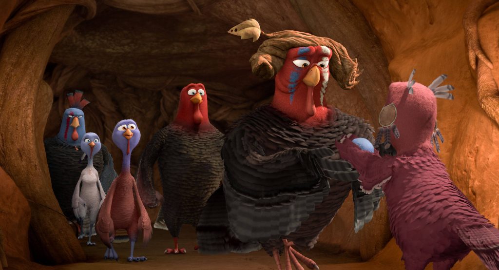 Free Birds CGI wallpaper featuring Chief Broadbeak and flock in rustic cavern with warm lighting