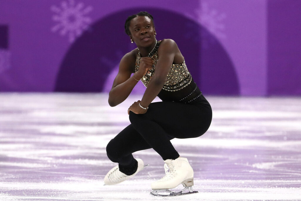 French figure skater Méité performs dynamic routine at 2018 Winter Olympics showcasing athleticism Wallpaper