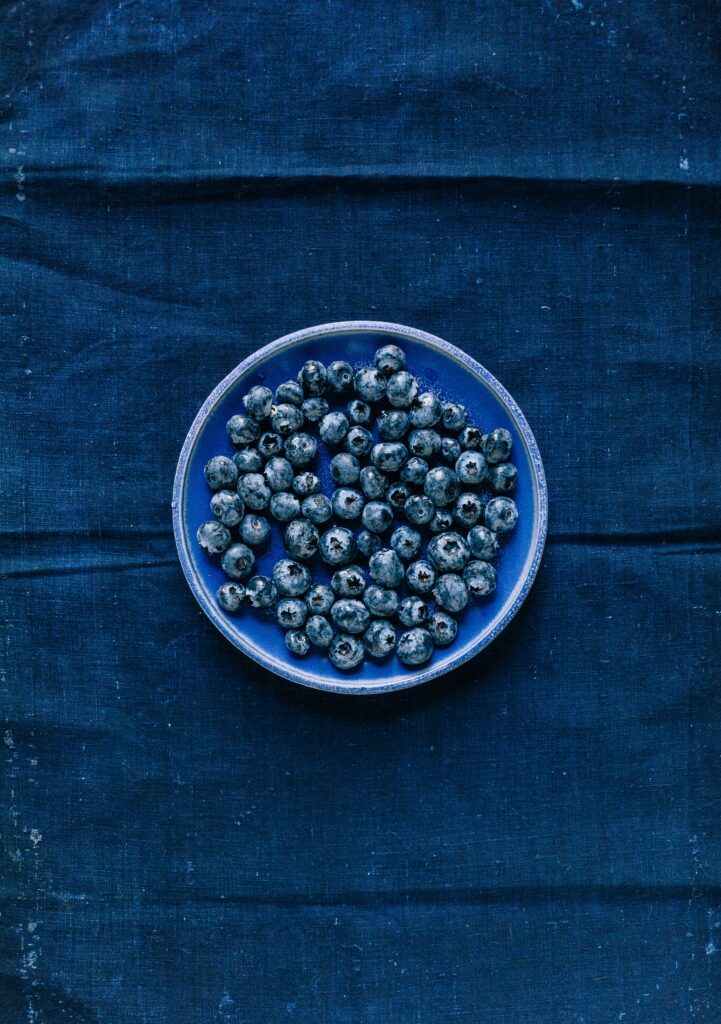 Vibrant Blueberry Plate on Denim Background - Stunning Wallpaper