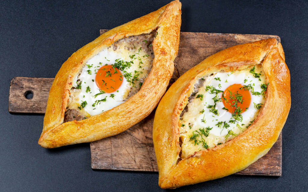 Delicious Georgian Khachapuri Wallpaper: Cheesy Crust & Fresh Eggs