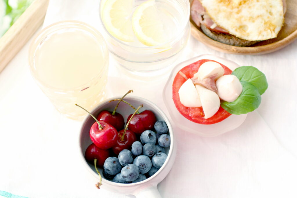 Vibrant Wallpaper: Fresh Cherries, Blueberries & Refreshing Table Setting