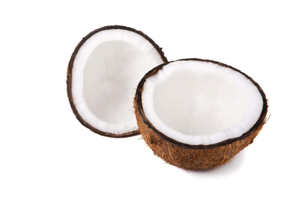 Two halved coconuts showing fresh white flesh and brown shells on a clean white background Wallpaper