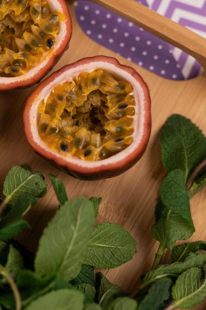 Vibrant Passion Fruit Wallpaper: Juicy Center & Lush Green Leaves