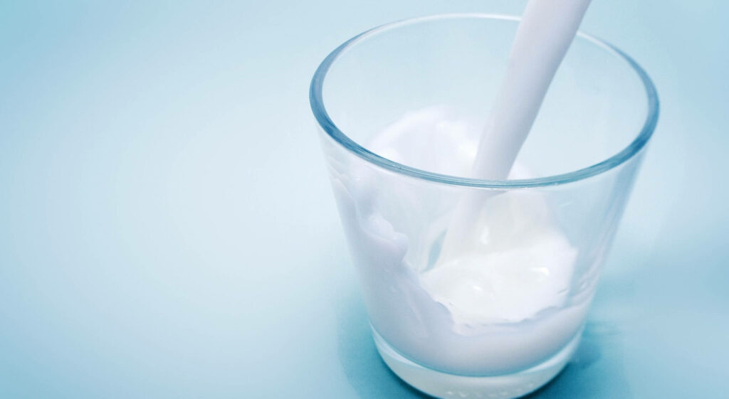 Refreshing Dairy Milk Wallpaper: Serene Blue Background Design