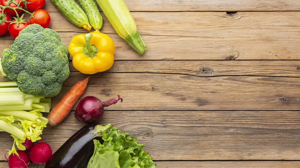 Vibrant colorful vegetables arranged on rustic wooden board fresh farm to table kitchen wallpaper