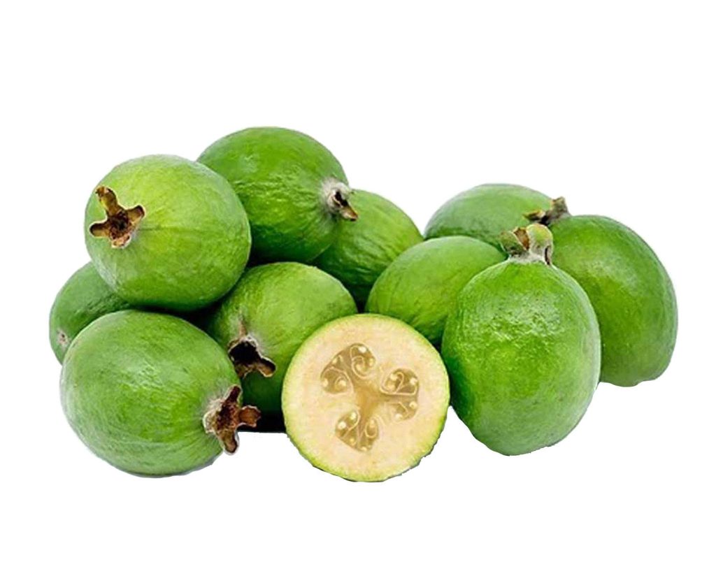 Cluster of fresh green feijoa pineapple guavas with sliced fruit showing creamy seeds on white Wallpaper