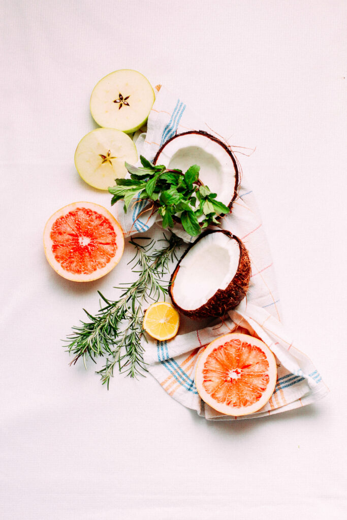 Fresh Fruit Wallpaper: Coconuts, Grapefruits & Apples on Light Background