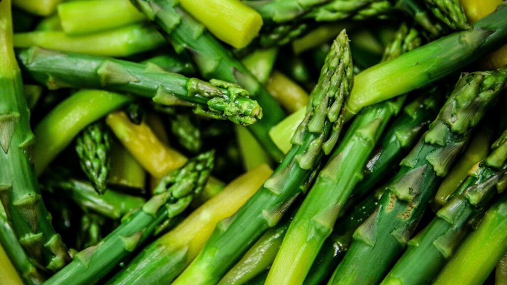 Close-up of fresh green asparagus spears with crisp texture vibrant natural color wallpaper