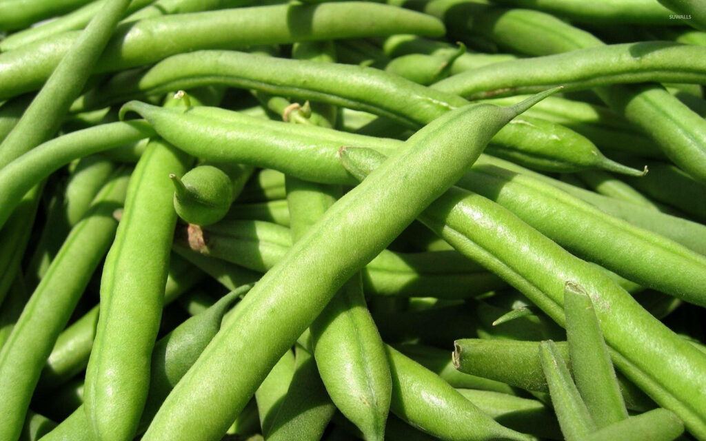 Close up of fresh green beans vibrant color crisp texture natural daylight wallpaper background