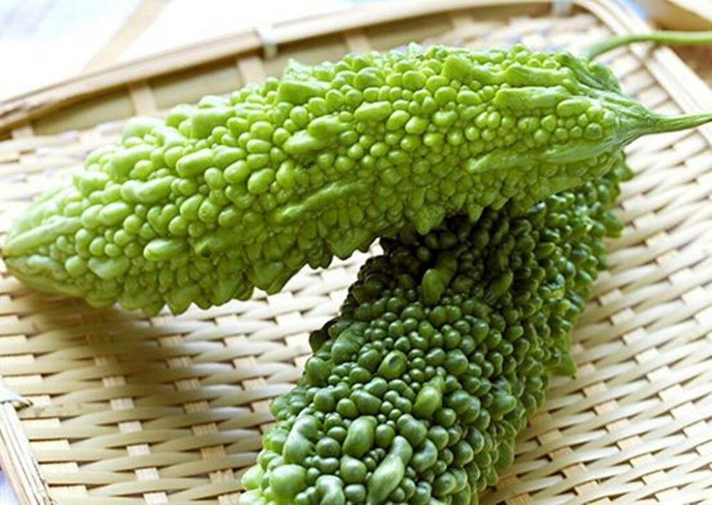 Vibrant Green Bitter Gourds on Bamboo Tray - Unique Wallpaper Background