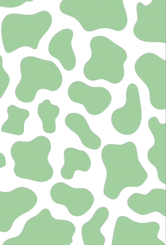 Playful cow print wallpaper with soft green patches on white background for modern decor