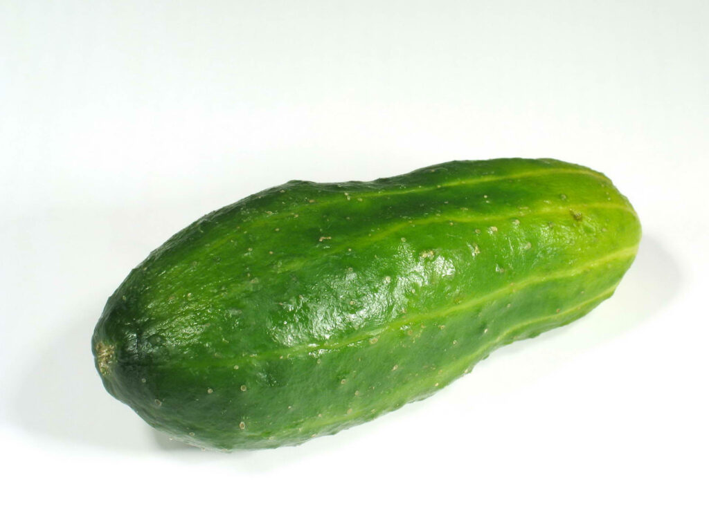 Fresh Green Gherkin Wallpaper: Textured Detail on White Background