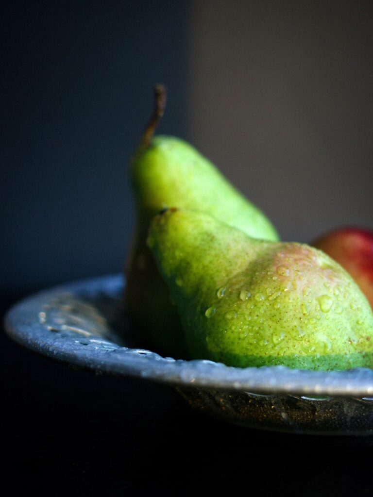 Macro Close-Up of Fresh Green Pears on Decorative Plate - Wallpaper