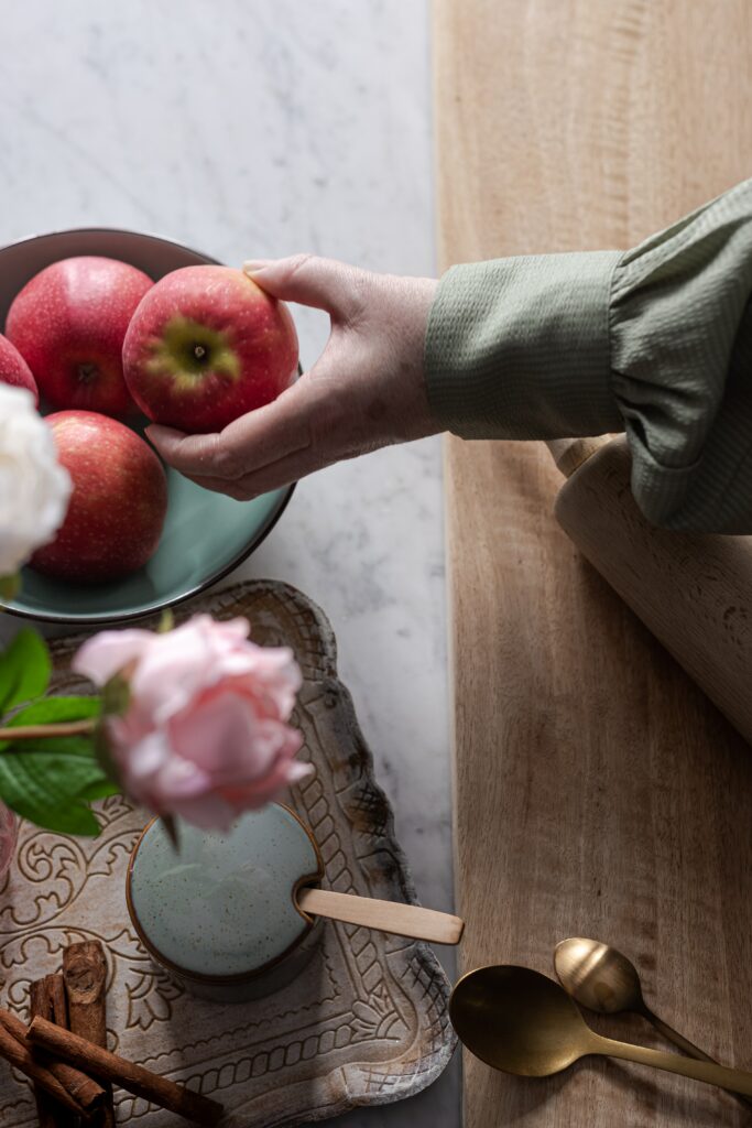Elegant Wallpaper: Fresh Red Apples, Flowers & Kitchenware Scene