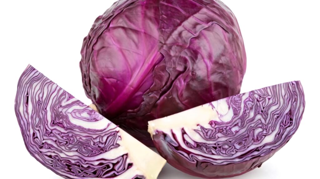 Fresh whole and sliced red cabbage with vivid purple white patterns on white background wallpaper