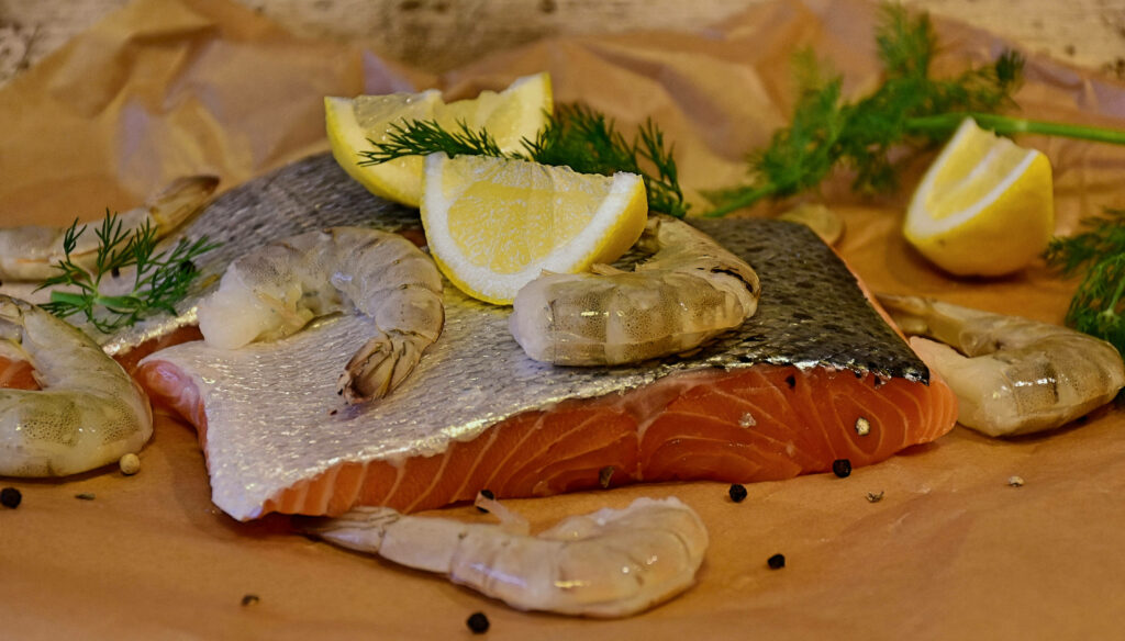 Seafood Wallpaper: Salmon & Scampi with Lemon on Rustic Background