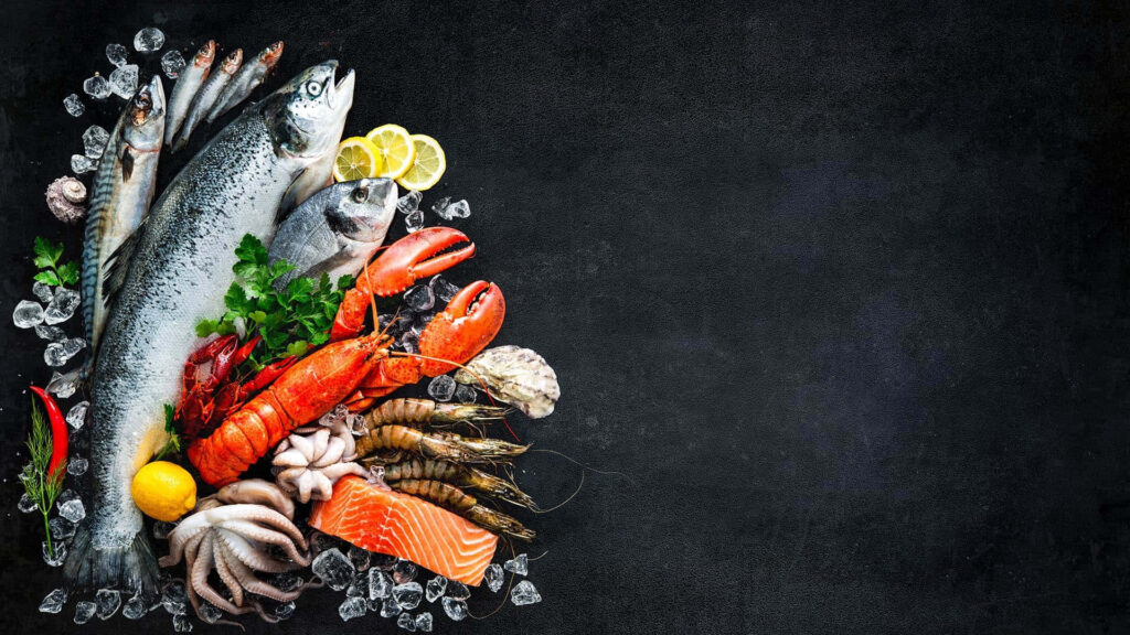 Vibrant Seafood Display on Ice - Striking Dark Wallpaper Background