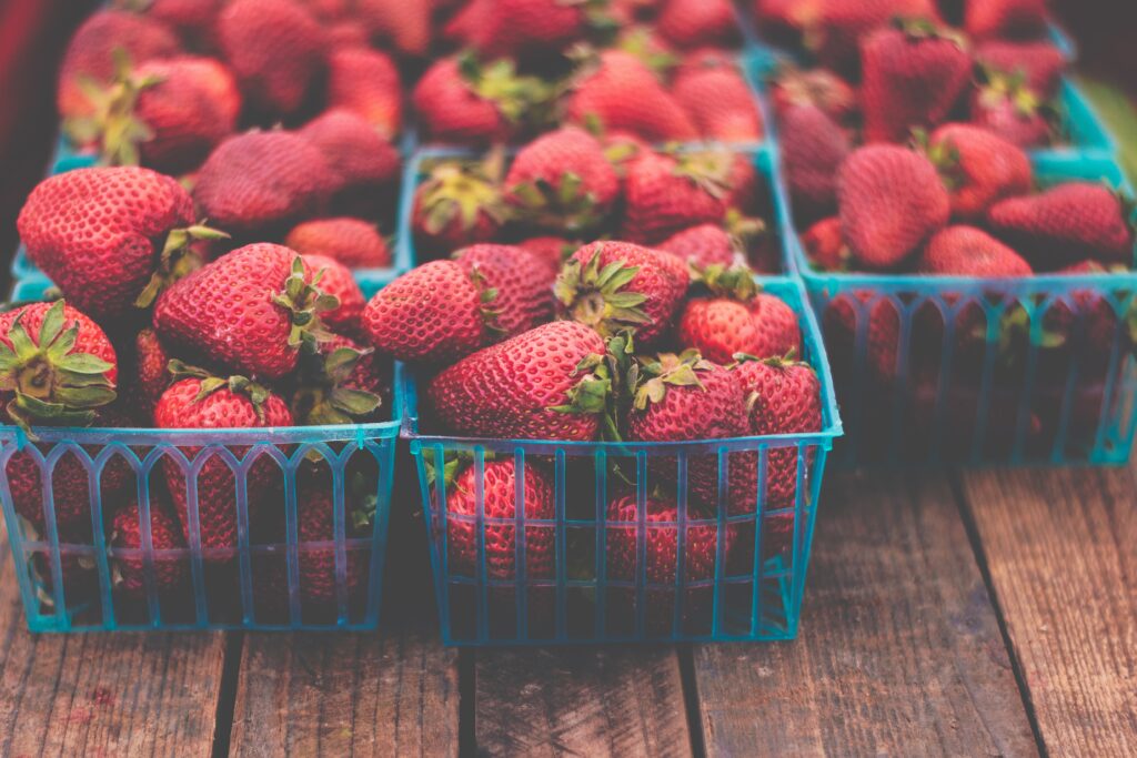 Fresh Strawberries in Blue Baskets - Rustic Wallpaper Background