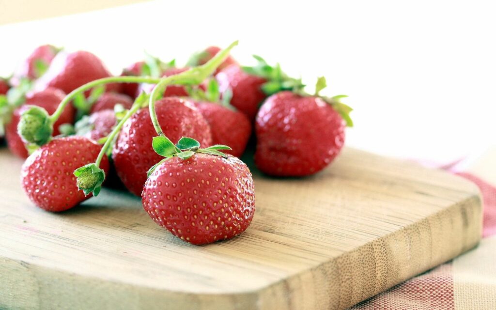 Vibrant Strawberry Wallpaper: Fresh Fruit on Wooden Table Background