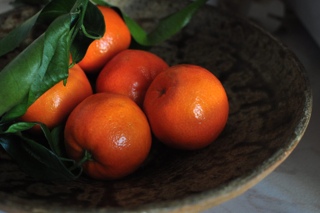 Fresh Tangerines in Rustic Bowl - Vibrant Citrus Wallpaper Background