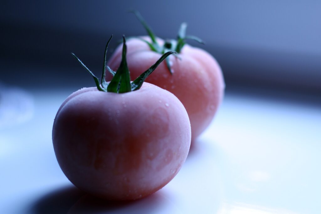 Fresh Tomato Wallpaper: Dewy Ripe Tomatoes on Soft Blurry Background