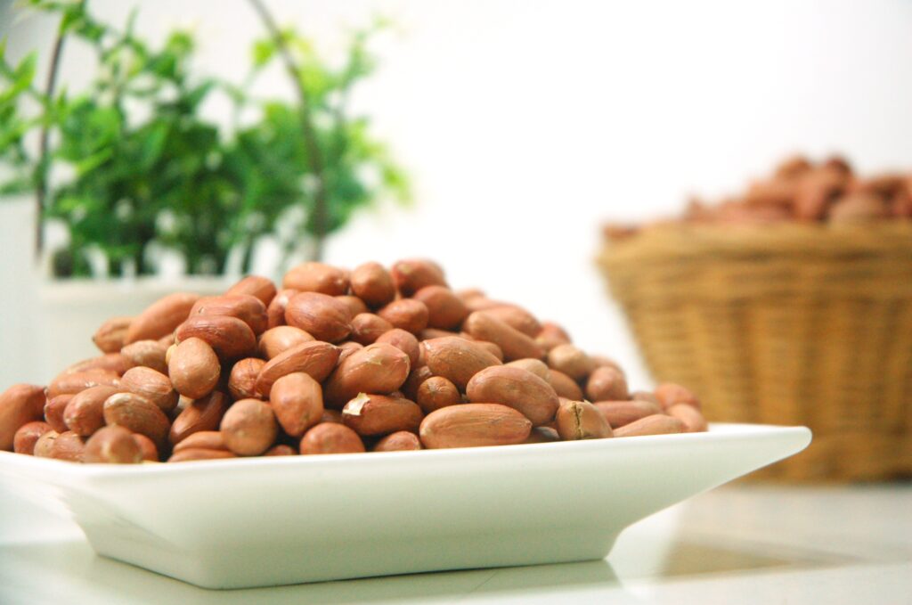 Fresh Unshelled Peanuts on a Plate: Beautiful Wallpaper Background