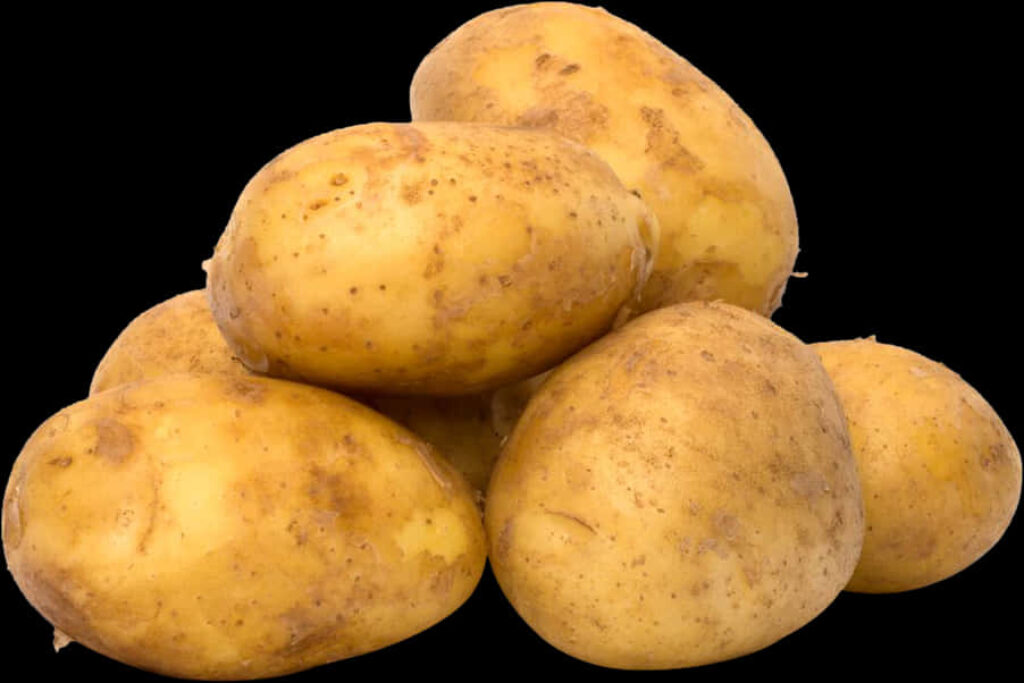 High-Quality Fresh Yellow Potatoes on Black Background Wallpaper
