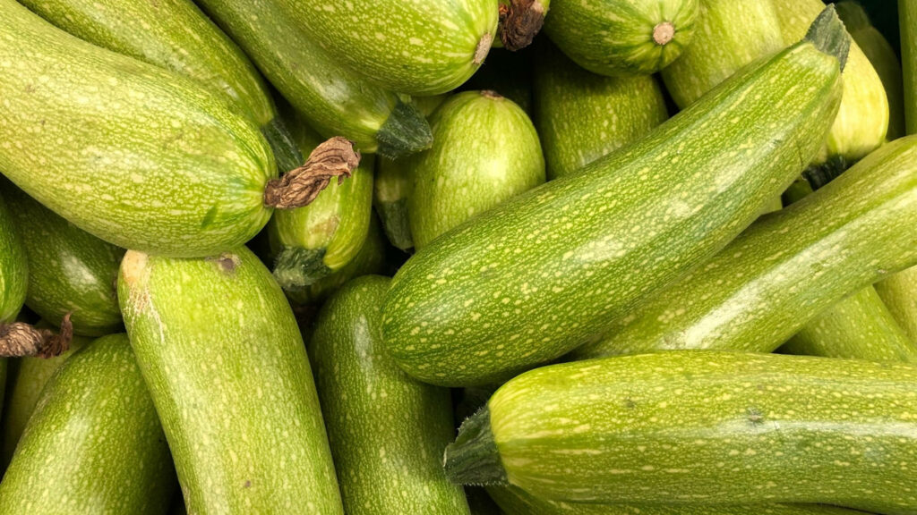 Vibrant Green Zucchini Close-Up Wallpaper Background
