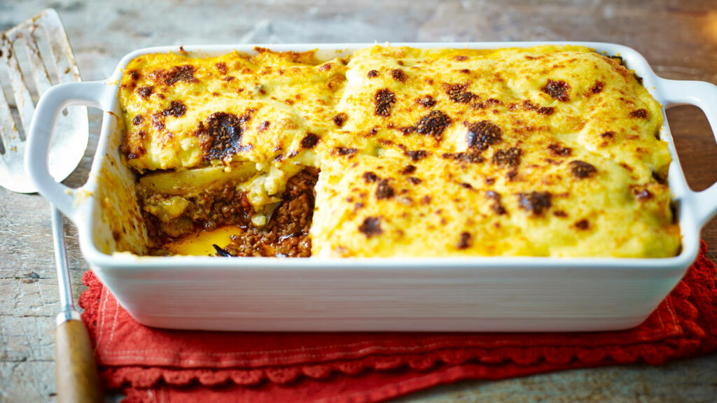 Freshly Baked Moussaka in White Tray - Rustic Wallpaper Background