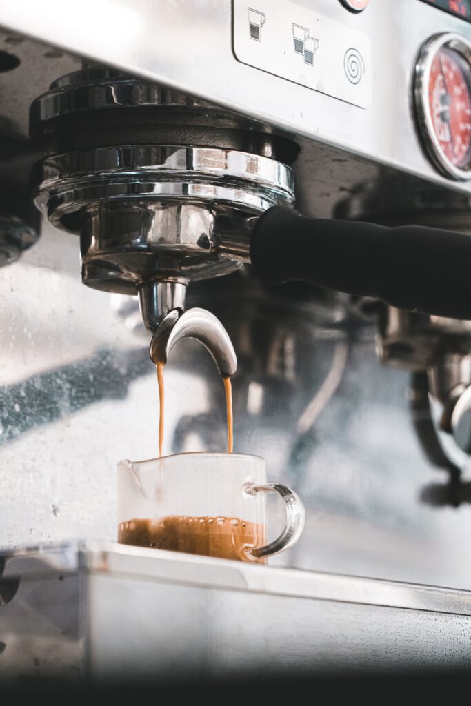 Close-Up of Coffee Machine Brewing Rich Texture in Glass Wallpaper